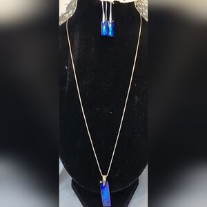 Vintage sterling silver jewelry set features rectangular blue stone